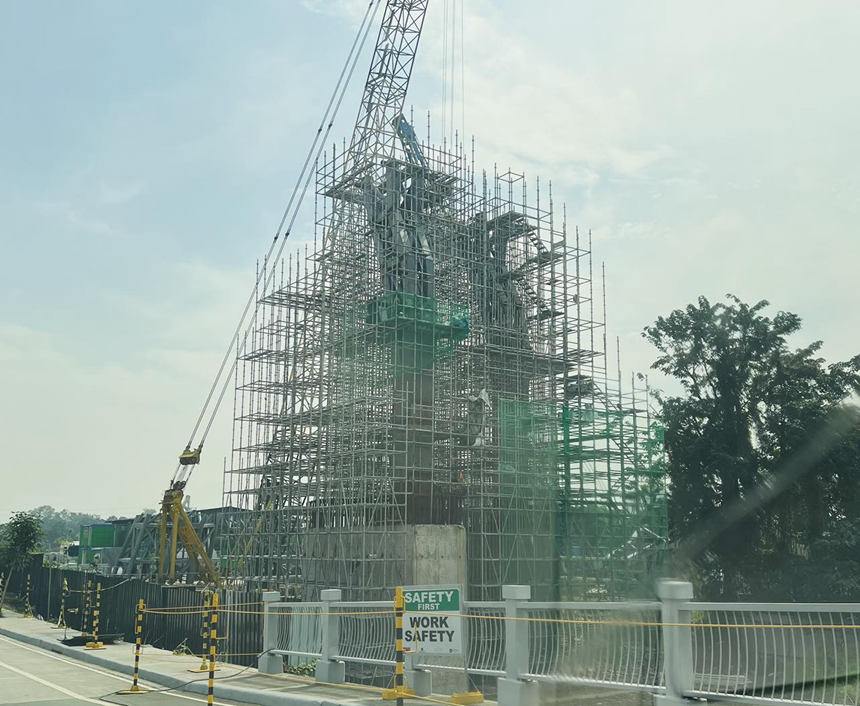 55.5m high perforated stainless steel man sculpture